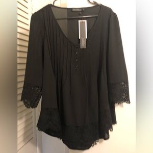 Women’s XL Black Blouse. 3/4 sleeves. Lace on sleeves and bottom front . NWT